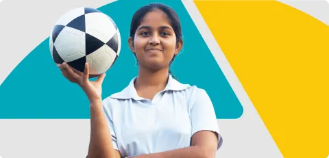 An image of a girl holding a football.